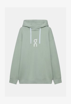 Felpa verde chiaro con cappuccio, coulisse bianche e logo stilizzato bianco al centro del petto, esposta su uno sfondo uniforme.