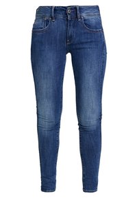 Mörkblå skinny jeans i denim med en tvättad effekt, som har en klassisk femficksdesign och metallknappslutning.