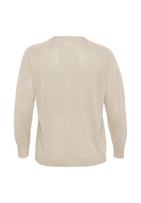 Beige knit sweater with a relaxed fit, long raglan sleeves, low V-shaped back seam, and ribbed cuffs and hem. Soft texture.