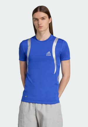 Blue short-sleeve athletic shirt with silver accents and Adidas logo. Smooth, lightweight fabric with a fitted design and crew neckline.