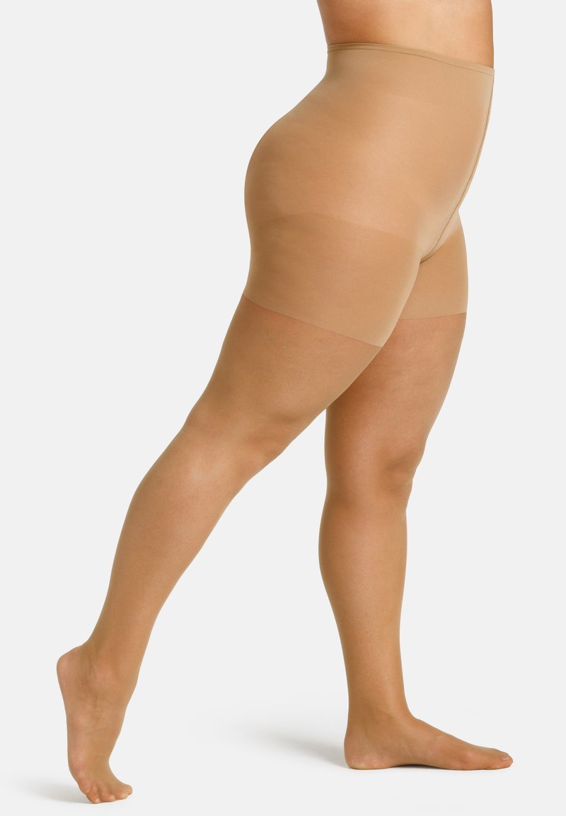 Collant opaco nudo con vita alta, texture liscia e design senza cuciture; presenta una finitura opaca e nessun motivo visibile.