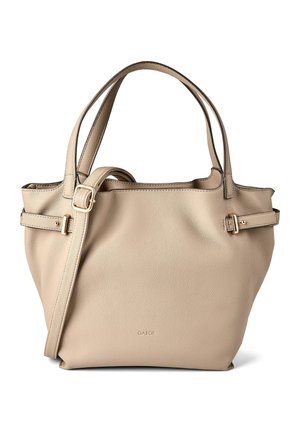 Borsa a mano in pelle beige con due spallacci, dettagli con fibbie regolabili sui lati e nome del marchio inciso in modo discreto sul davanti.