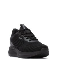 Zapatillas deportivas negras con parte superior de punto texturizado, suela acolchada y diseño aerodinámico. Presentan cordones y un collar acolchado para mayor comodidad.