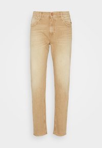 Ljust beige denimjeans med rak passform, fem fickor och blekt yta. Har knappstängning och bälteshällor.