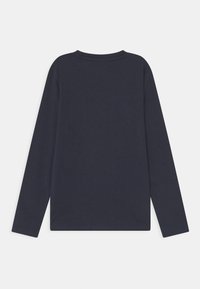 Long-sleeve t-shirt in dark navy cotton, featuring a crew neck and a simple, unembellished design. Smooth texture, casual fit.