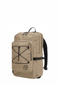 Sac à dos rectangulaire beige avec poche zippée à l'avant, bretelles réglables noires, cordon élastique sur la poche, et logo empreinte de patte dans le coin inférieur droit.