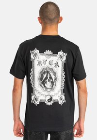 Black short-sleeve t-shirt featuring a detailed white graphic of a skull, roses, and a yin-yang symbol on the back.