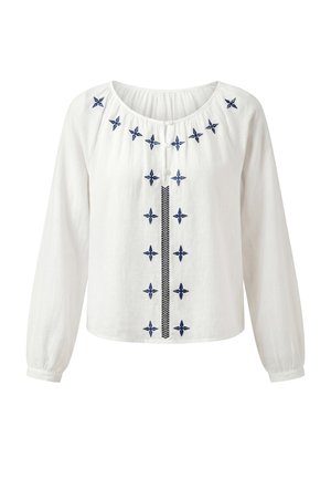 Witte blouse met lange mouwen en ronde hals, blauwe geborduurde sterrenpatronen langs de halslijn en middenvoor, twee knopen bovenaan.