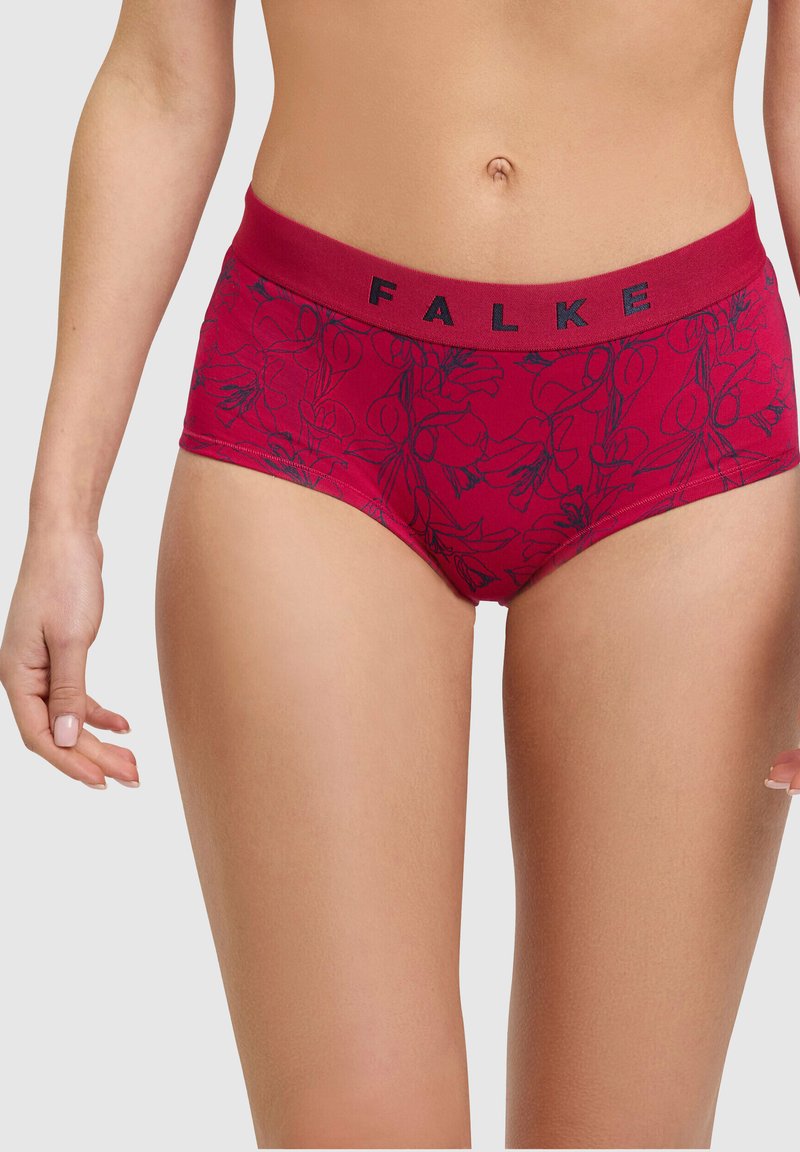 Czerwone figi hipsterskie w kwiatowy wzór z miękkiego, elastycznego materiału. Talia ozdobiona jest czarnym napisem marki "FALKE".