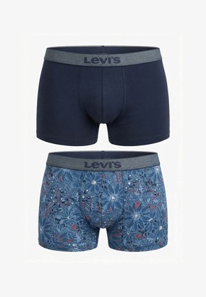 Dos pares de calzoncillos bóxer Levi’s, uno azul marino liso y otro azul con un estampado floral, ambos con cinturillas elásticas grises.