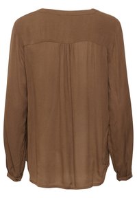 Bruine blouse met lange mouwen van een lichte, gestructureerde stof. De achterkant heeft een yoke en plooien; knopenmanchetten bevestigd aan de mouwen.