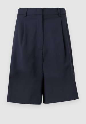 Shorts ajustés bleu marine en tissu lisse avec taille haute, plis à l'avant et poches latérales. Silhouette propre et structurée.