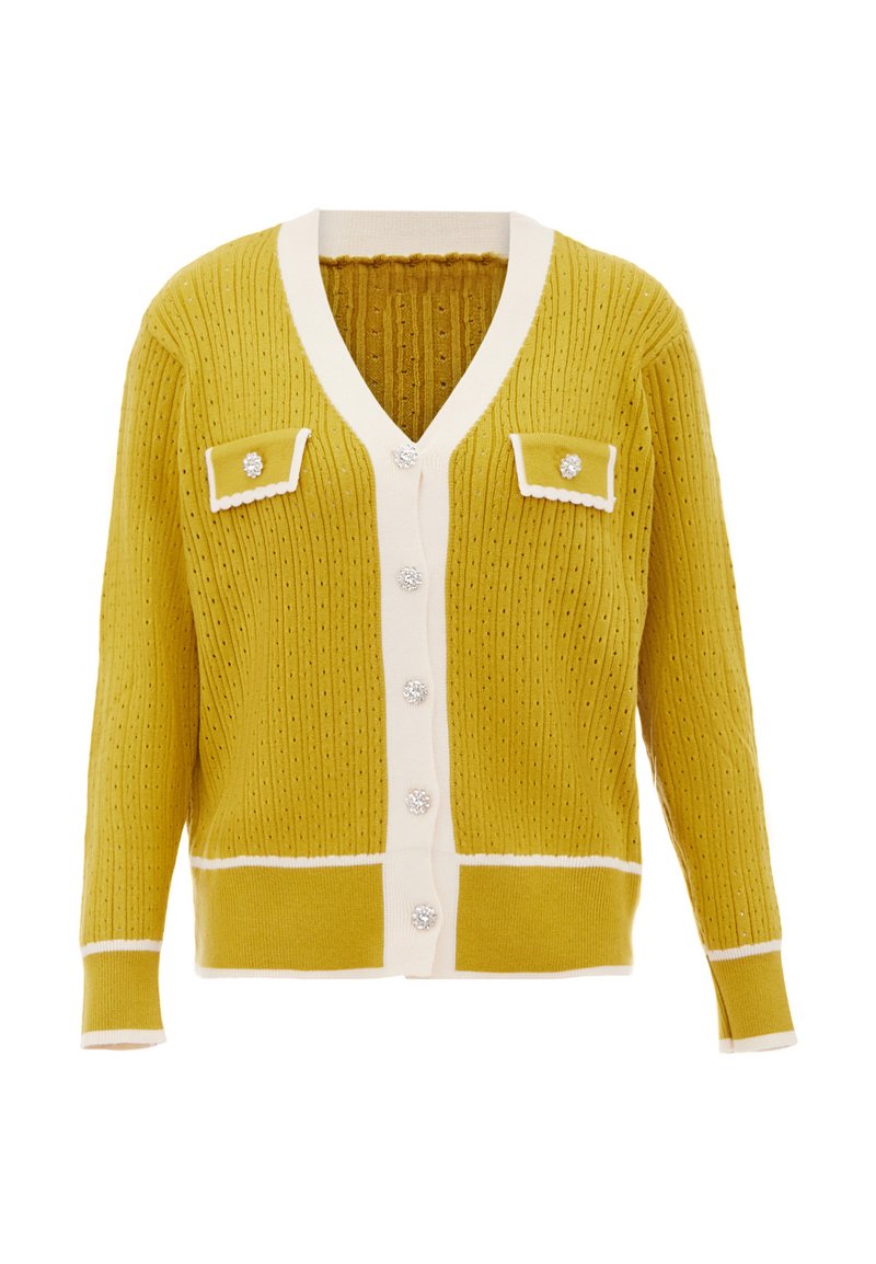 Senapsgul kofta med V-ringning, vit kant, två bröstfickor och dekorativa knappar. Texturerat ribbat tyg genomgående.