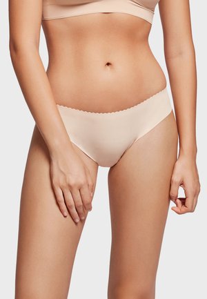 Light pink seamless panties with a scalloped waistband, made from soft fabric. The design offers a smooth silhouette and minimal coverage.