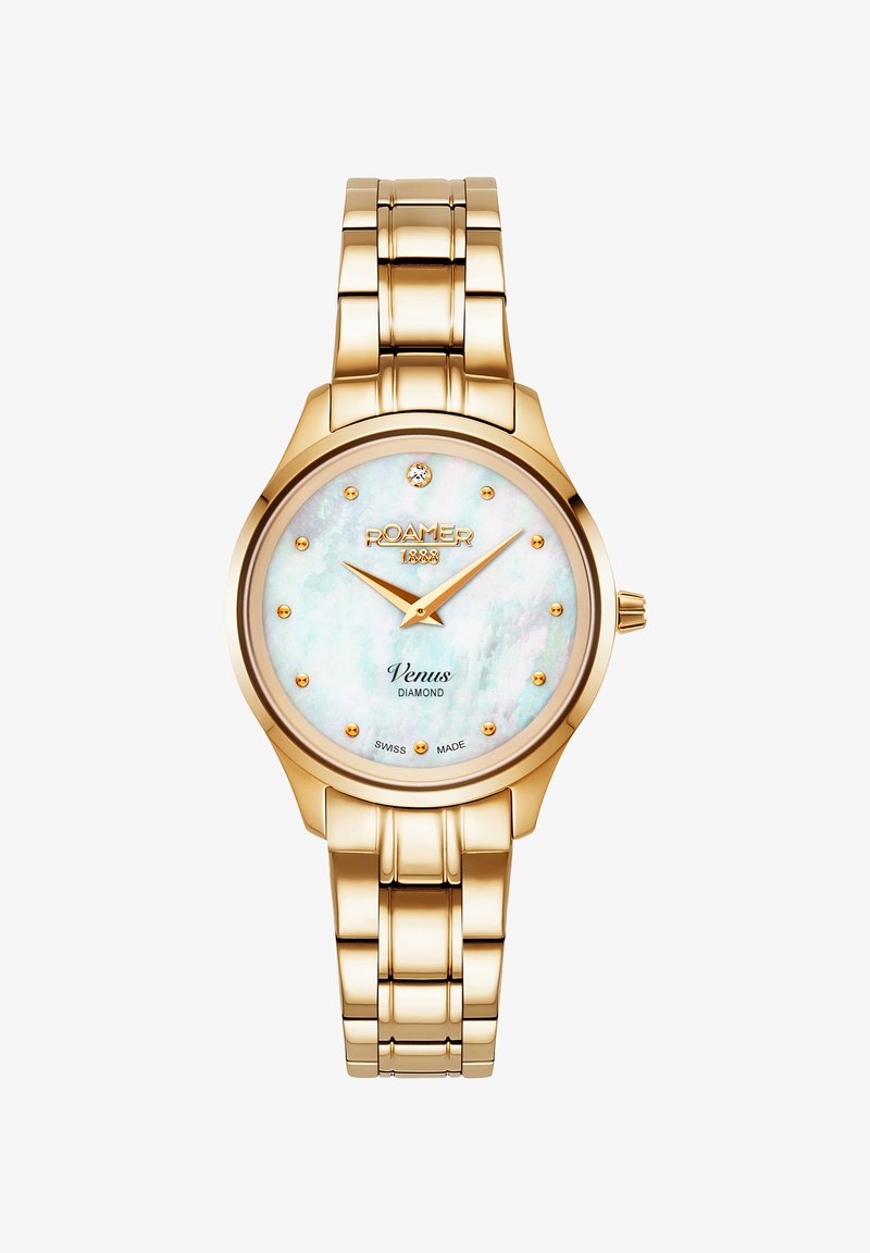 Guldtonad metallarmbandsur med en rund, iriserande pärlemor-dial som har diamantdetaljer och guldmarkörer på ett länkarmband.