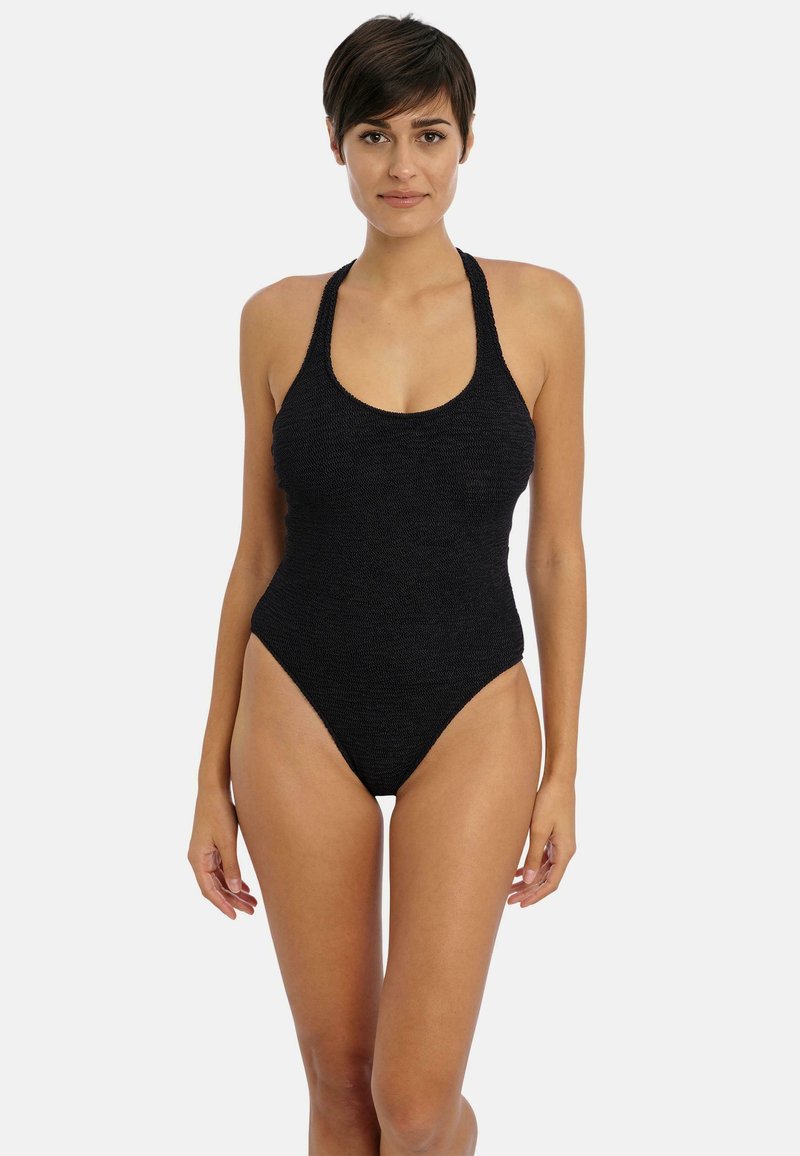 Maillot de bain une pièce noir avec un tissu texturé, un design à tour de cou, un décolleté plongeant et des ouvertures de jambes hautes.