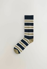 Navy blue sock with horizontal stripes in olive green and white. Soft fabric, ribbed cuff, reinforced heel, and toe in olive green.