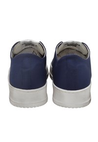 Navy blue canvas shoes with a white rubber sole, featuring a simple design and smooth texture. Back view shows rounded heel and minimal detailing.