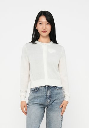 White, lightweight cardigan with a round neck, button closure, and long sleeves. Features a subtle logo on the chest and ribbed hem.