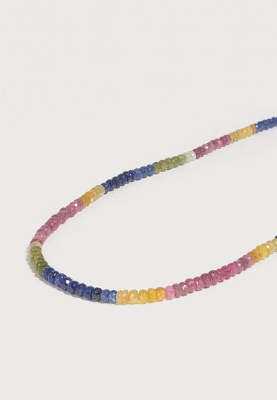 Πολύχρωμο στρογγυλό χάντρα με όψεις, σε συνεχή βρόχο σε λευκό φόντο.