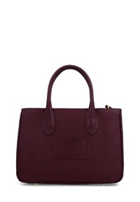Dark burgundy textured leather handbag with two rounded handles and a rectangular patch on the front, set against a white background.