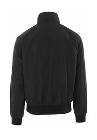 Giacca bomber nera con colletto alto, polsini a costine e vita aderente. Tessuto morbido senza loghi o decorazioni visibili.