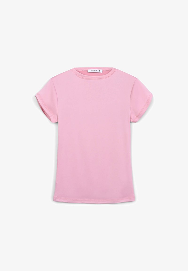 T-shirt in cotone rosa a maniche corte con scollatura rotonda classica e vestibilità rilassata, caratterizzato da dettagli di orlo cuciti. Etichetta della taglia "S" visibile.