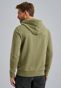 Olive green hoodie with a drawstring hood, ribbed cuffs, and waistband. The fabric appears soft and casual, suited for relaxed wear.