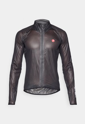 Veste de cyclisme noire à manches longues, fabriquée en tissu léger et fin. Dotée d'une fermeture éclair full-length et d'un col haut. Logo Castelli sur la manche.