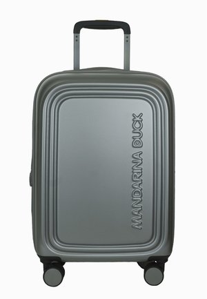 Silver hard-shell carry-on suitcase with a textured surface, recessed grooves, two wheels, and a retractable handle. Brand name displayed prominently.