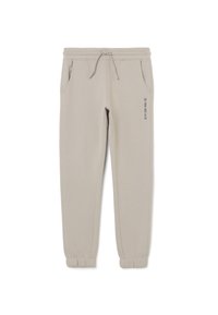 Pantalones jogger beige claro con cinturilla y puños elásticos, cordón, bolsillos laterales y la frase "LA NIEVE DEBE CONTINUAR" impresa en el muslo izquierdo.