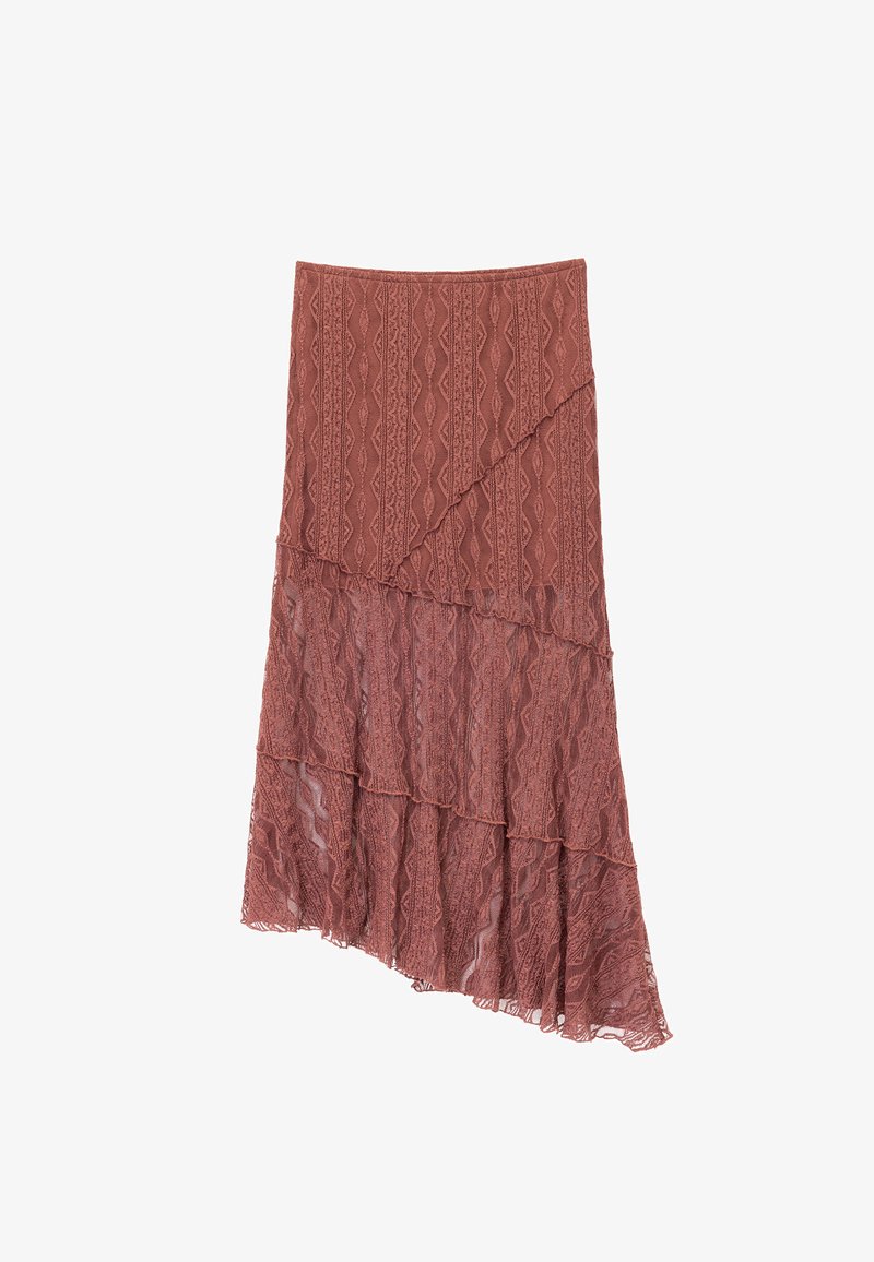 Jupe maxi dans une couleur rose chaud, mettant en avant des couches de dentelle avec des motifs en zigzag. L'ourlet asymétrique ajoute de la dimension au design.