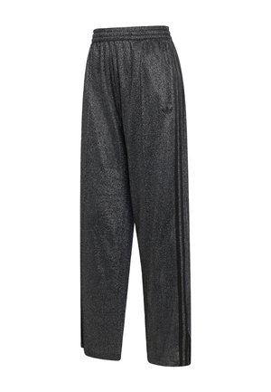 Pantalones de chándal anchos y brillantes de color negro con cinturilla elástica y tres franjas negras que bajan por los lados.