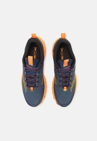 Navy and orange running shoes with a mesh upper, textured laces, and tab at the heel. Features a logo and cushioned sole.
