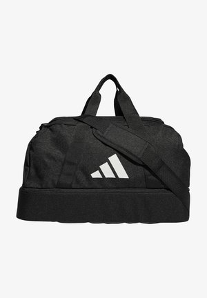 Zwarte sporttas van textuurstof, met dubbele handvatten, een verstelbare schouderband en een opvallend wit logo aan de zijkant.