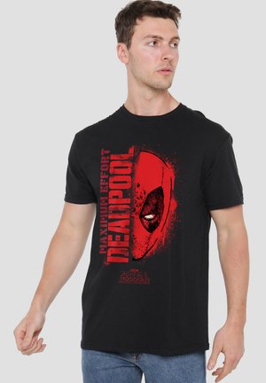 Black cotton T-shirt featuring a red graphic of a masked character's face and text "MAXIMUM EFFORT DEADPOOL" on the front.
