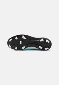 Black rubber outsole with white traction studs, featuring a smooth texture and subtle curved design. Light blue midsole with red accents.