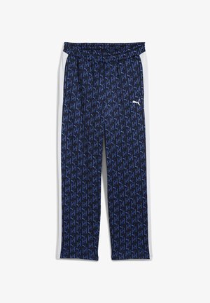 Granatowe spodnie sportowe z powtarzającym się wzorem niebieskiego logo, elastycznym pasem, białymi paskami po bokach oraz małym białym logo na udzie.