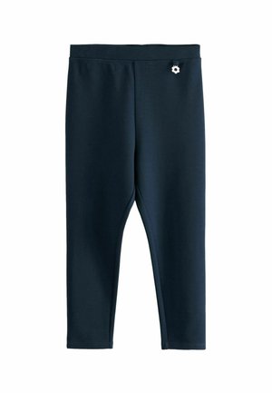 Marineblaue Leggings aus elastischem Stoff, mit einer engen Passform und einem kleinen dekorativen Element an der Taille. Glatte Textur.