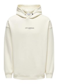 Haut à capuche crème en tissu doux, doté d'une poche kangourou à l'avant et du texte 'LES CLASSIQUES' au centre.