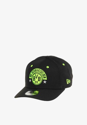 Black adjustable baseball cap with neon green "BVB 09" logo, text "Die Schwarzgelben," two white stars, and New Era logo on the side.