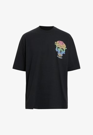 Black cotton t-shirt with a crew neckline, featuring a colorful skull graphic with flowers on the left chest and loose-fitting short sleeves.