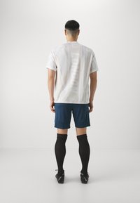 Nike Performance ACADEMY SHORT - Pantalón corto de deporte - court blue/white