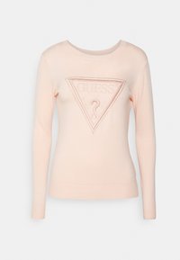 Jasnoróżowy sweter z długimi rękawami, okrągłym dekoltem i teksturowanym trójkątnym logo z przodu. Miękki dzianinowy materiał.