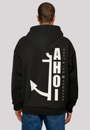 Black hooded sweatshirt featuring a large white graphic with text and an anchor design. Relaxed fit with ribbed cuffs and hem.