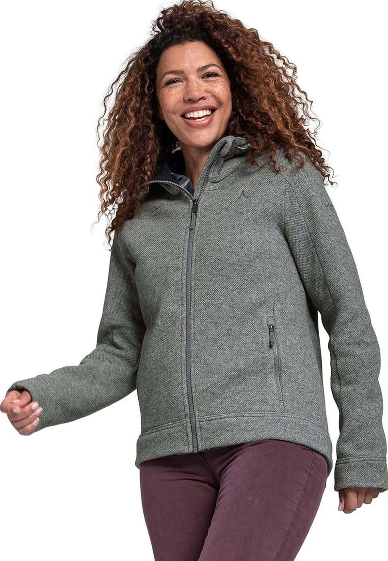 Graue Fleecejacke mit Kapuze, ausgestattet mit einem vollständigen Reißverschluss und seitlichen Taschen. Glatte Textur und lockere Passform, kombiniert mit dunkelvioletten Hosen.