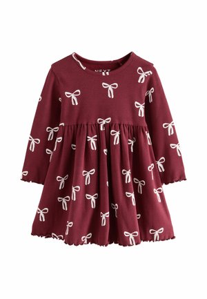 Burgunderfarbene Babykleid mit langen Ärmeln, gerafftem Rock und weißen Schleifenmustern überall.