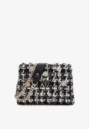 Zwart-wit tweed handtas met een gouden kettingriem, zwarte leren accenten en decoratieve strass appliqués. Logo label aan de voorkant.