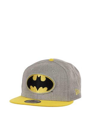 Gray cap with a yellow brim, featuring a large black Batman logo embroidered on the front. Includes yellow accents on the top button.