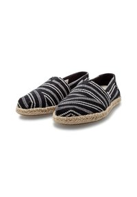 Black and white striped espadrilles with woven fabric uppers, rounded toes, and natural jute soles. Lightweight and slip-on design.